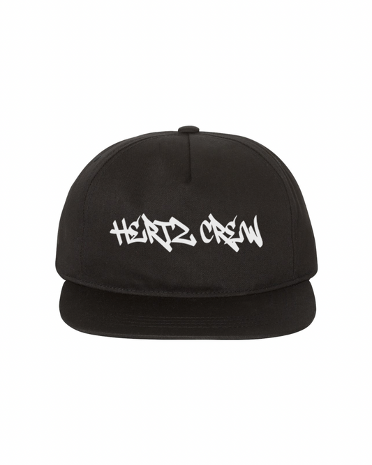 A black, unstructured, high-profile 5-panel hat with 'Hertz Crew' graffiti font in white embroidered on the front.