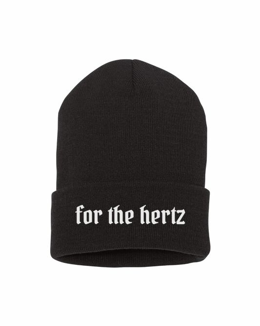 Black knit cuffed beanie with white text 'for the hertz' printed on the fold.