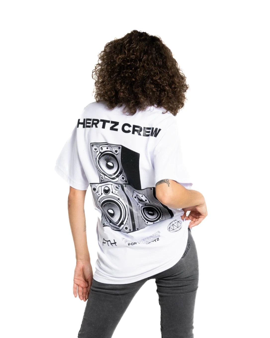 Model wearing heavyweight white t-shirt with 'HERTZ CREW' and speaker design on the back.